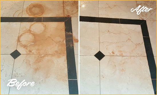 Before and After Picture of a Knightdale Hard Surface Restoration Service on a Marble Floor to Eliminate Rust Stains